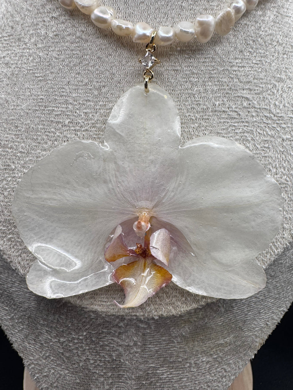 White Orchid on String of Natural Freshwater Pearls