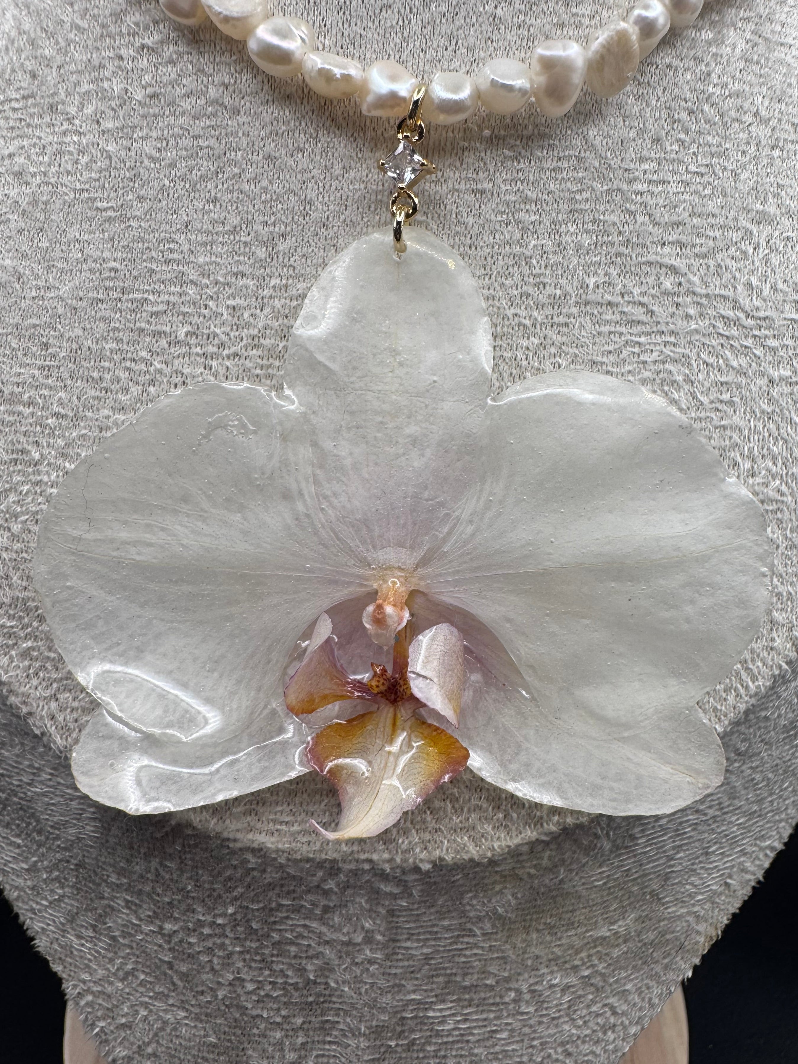 White Orchid on String of Natural Freshwater Pearls